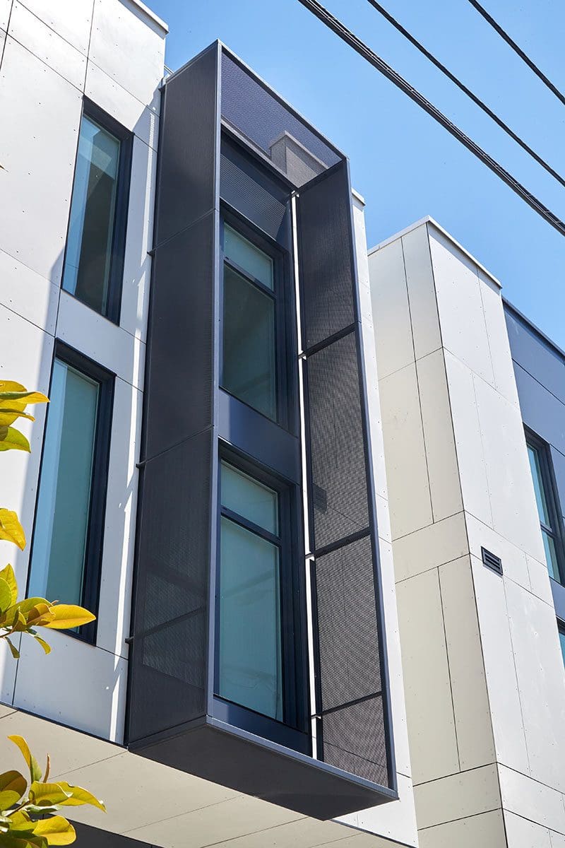 A Photo of a Modern Building With a Protruding Window